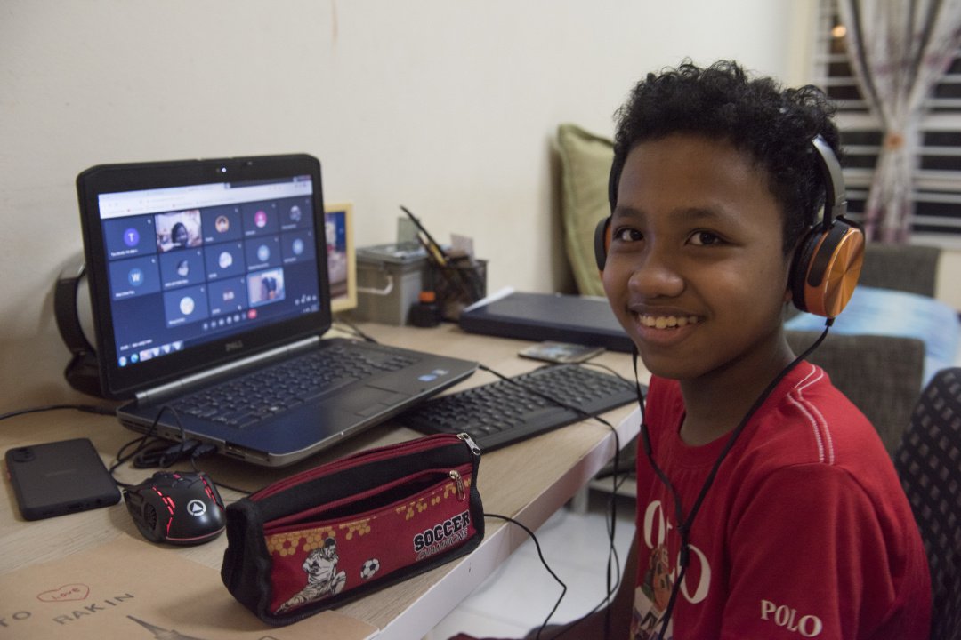 Rakin, who is enrolled in the “i∙didik” programme, has made excellent learning progress and become more cheerful. [Photo by Kevin Tan Kok Sieong]