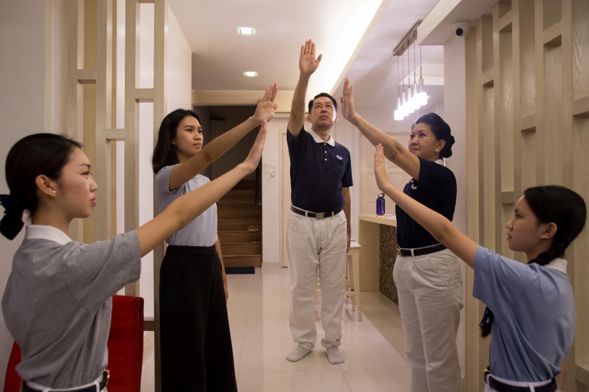 Wong Swee Nyun (middle) and his family became better persons thanks to the Dharma. [Photo by Sam Pin Fook]